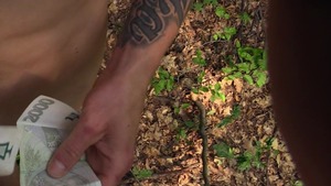 Tatted-up man pulls down his jeans and nails outside